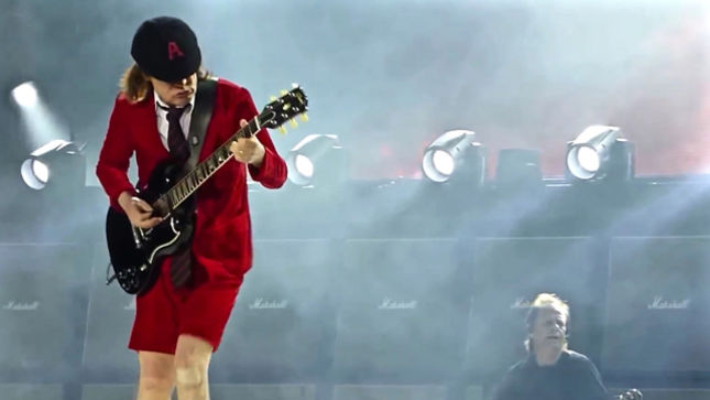 AC/DC’s Angus Young Watches Fan Roger Federer At French Open