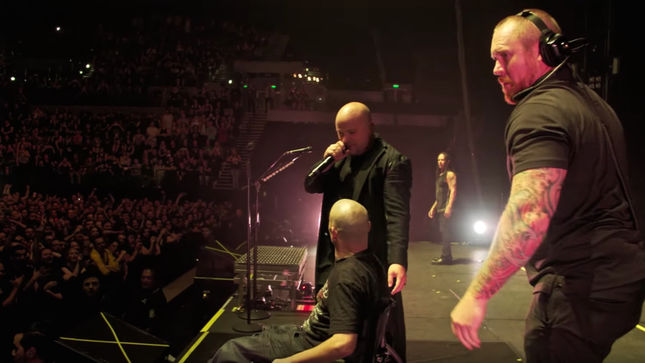DISTURBED Bring Wheelchair-Bound Fan On Stage In New Zealand - “You Won’t See This Kind Of Bravery, Courage, Strength At A Pop Show,” Says DAVID DRAIMAN; Video