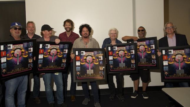 TOTO Presented With Plaques Honoring 40 Million Worldwide Sales