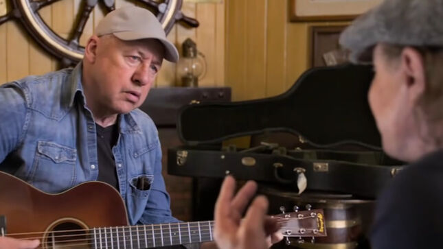 DIRE STRAITS' MARK KNOPFLER Performs "Sailing To Philadelphia" For AC/DC Singer BRIAN JOHNSON In "A Life On The Road" Flashback Video