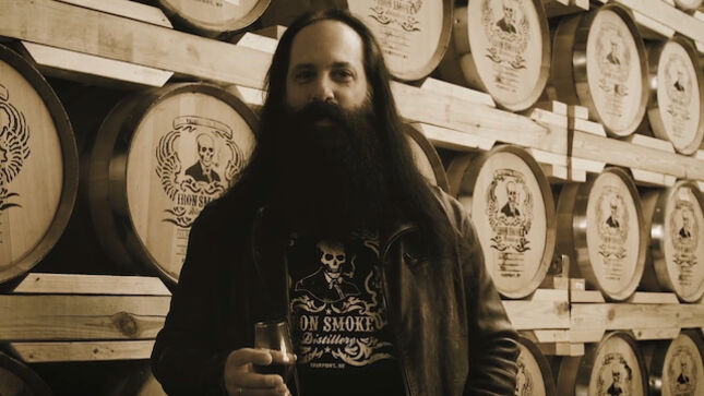 DREAM THEATER Guitarist JOHN PETRUCCI Collaborates With Iron Smoke On Rock The Barrel Signature Straight Bourbon Whiskey; Video Trailer