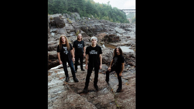 Between A Rock And A Prog Place: VOIVOD’s DANIEL ‘CHEWY’ MONGRAIN On The Album Title, Synchro Anarchy – “Our Drummer Wanted To Go To His Drum Riser, But His Shoelace Was Detached…And He Almost Killed Himself!”
