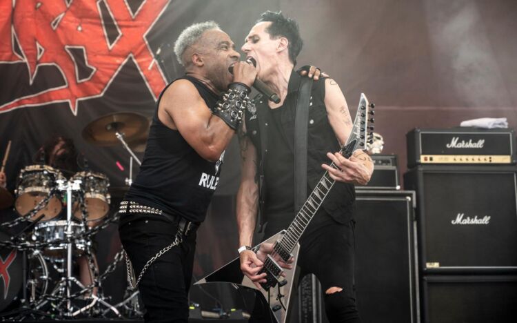 Watch Former SODOM Guitarist ANDY BRINGS Perform “Bombs Of Death” With HIRAX And Rock Hard Festival 2026; Fan-Filmed Video